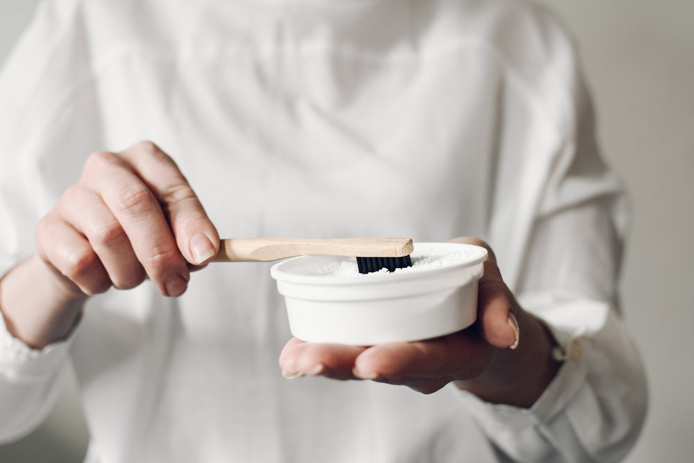 Herbal tooth powder ingredients including neem, clove, and natural minerals