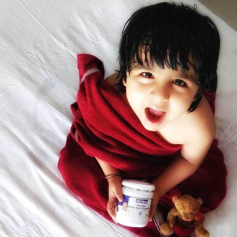Happy baby after using ByGrandma bath powder